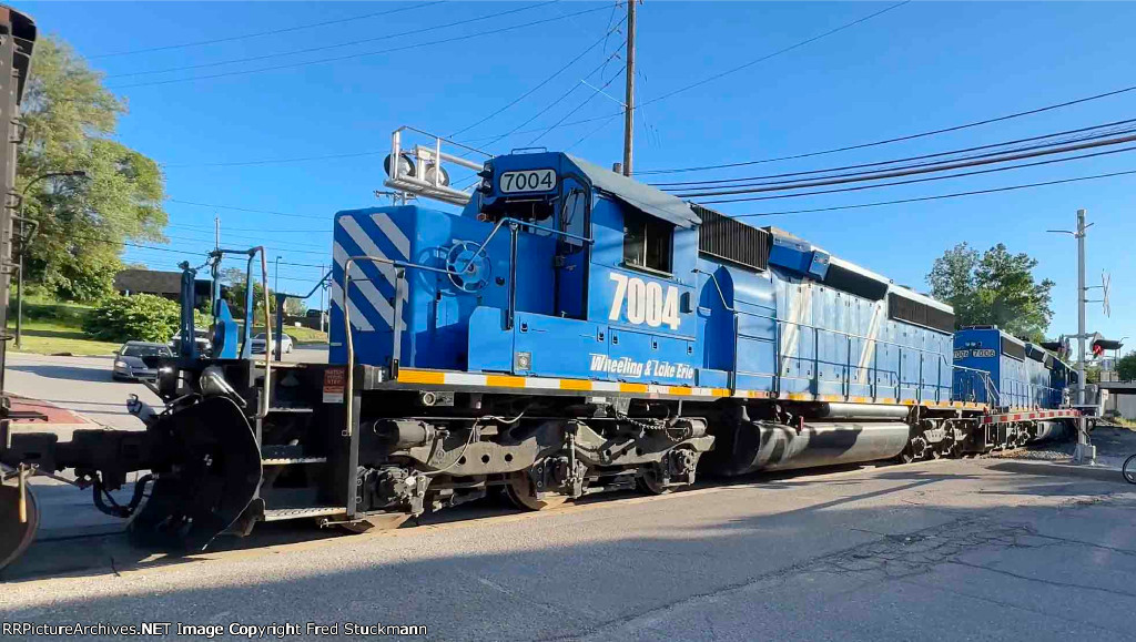 WE 7004 now shoves the empties into Rock Cut Siding.